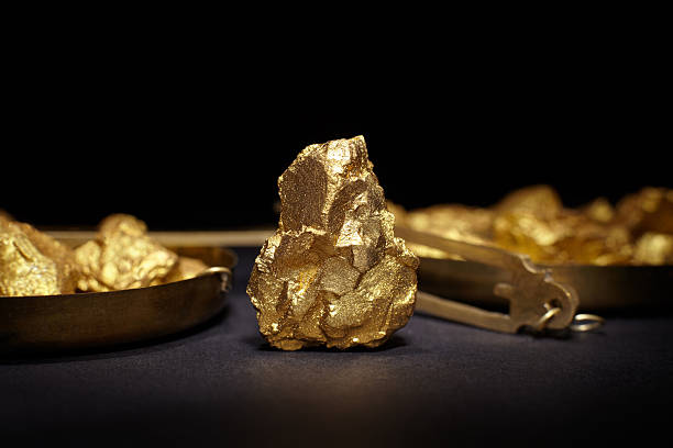 Closeup of big gold nugget on a black background